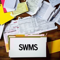 A cluttered desk overflowing with papers being rep