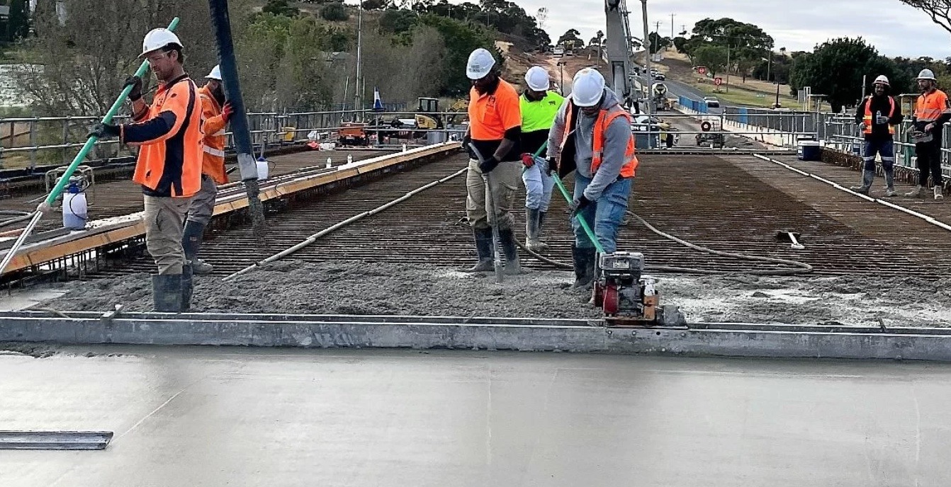 workers laying concete